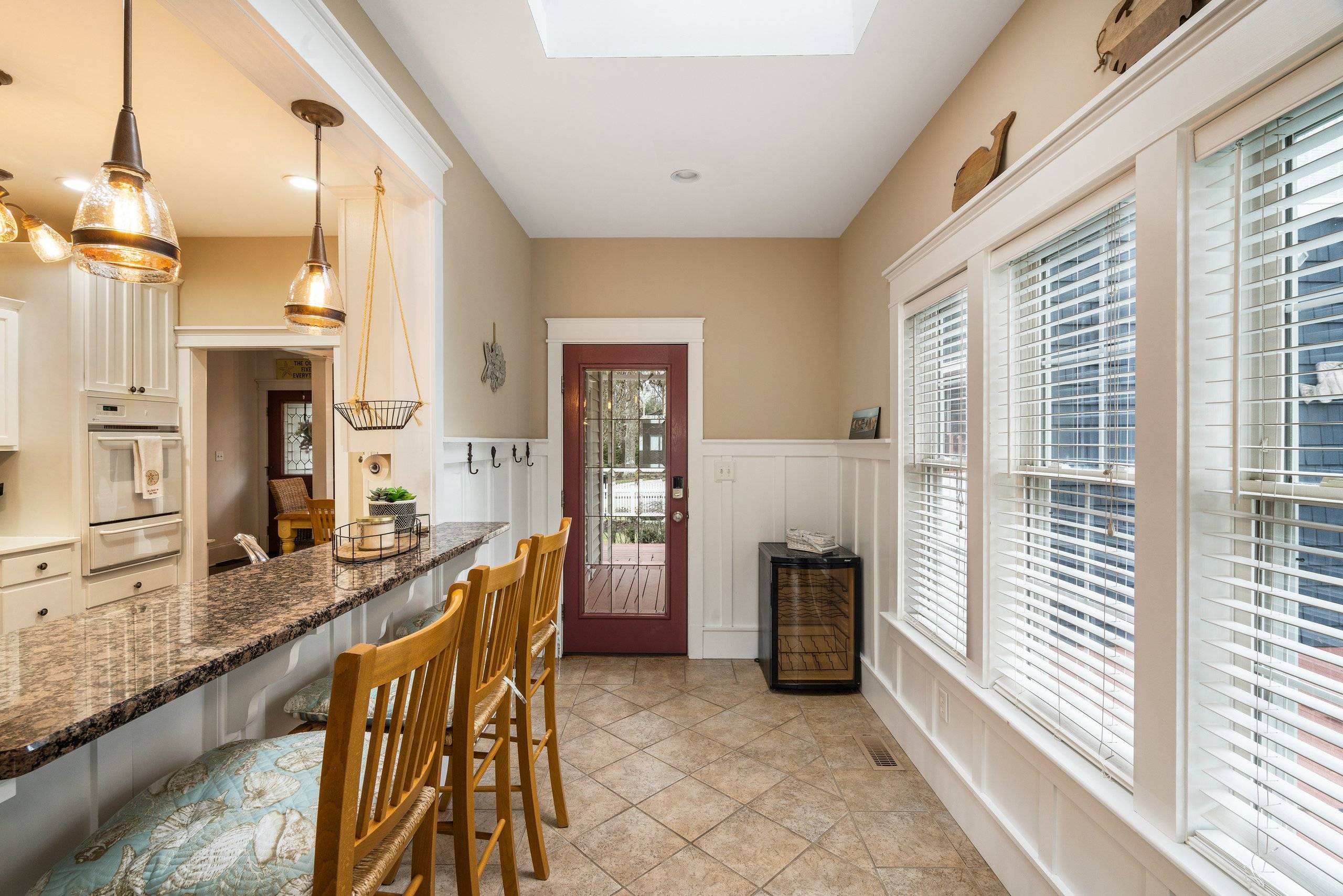 Breakfast bar under the skylight, door to the deck